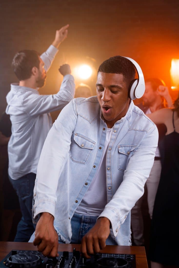 Man in headphones dancing at a party